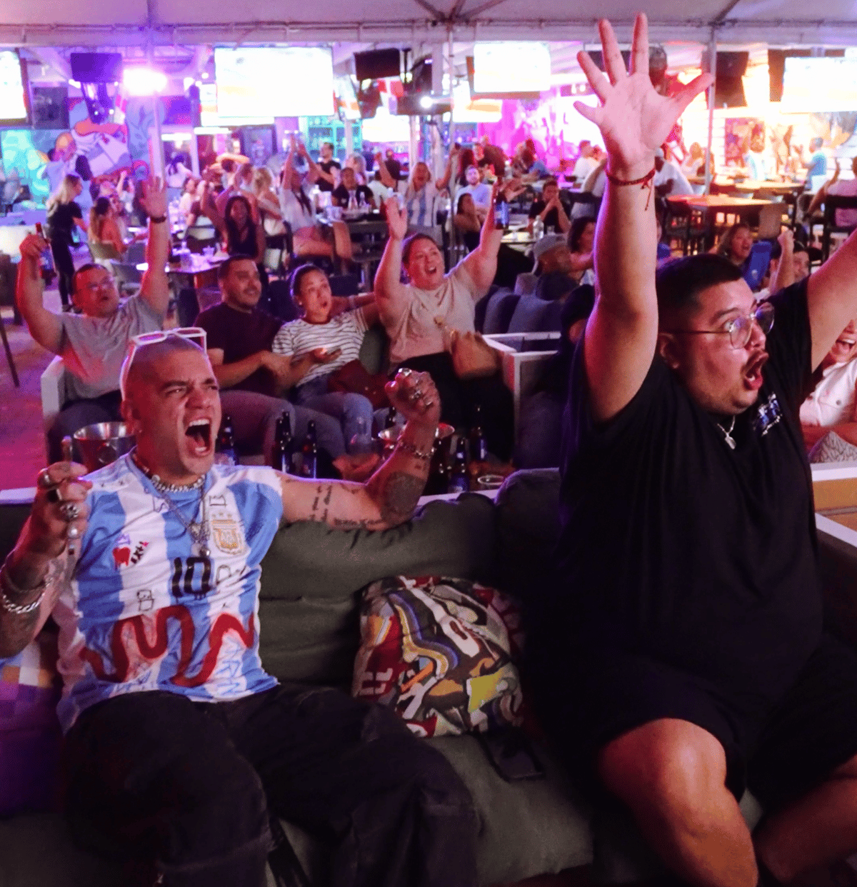 Argentina fans erupting in celebration during a World Cup watch party at Grails Miami, Miami's home World Cup bar