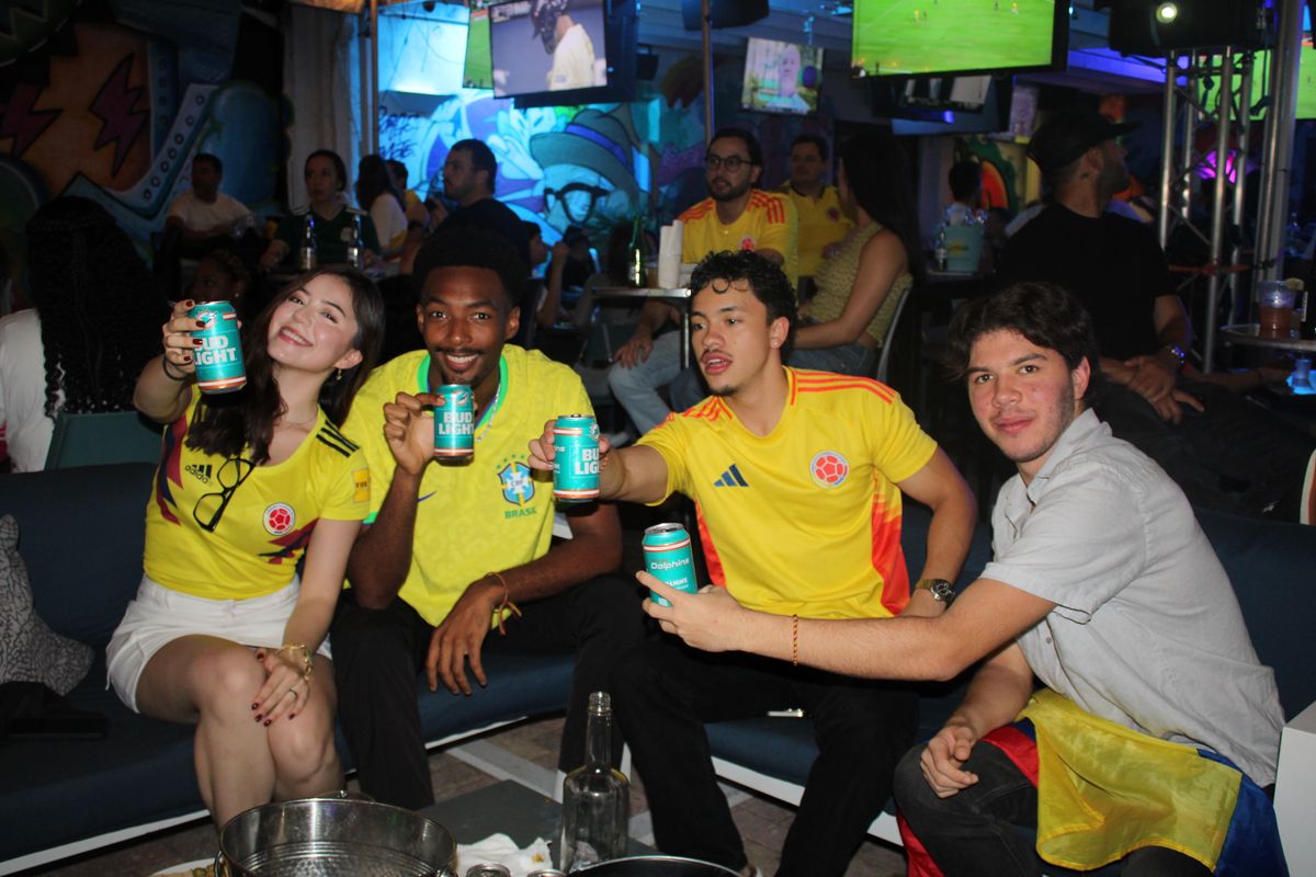 Brazilian and Colombian fans sharing the bar during a soccer watch party at Grails Miami