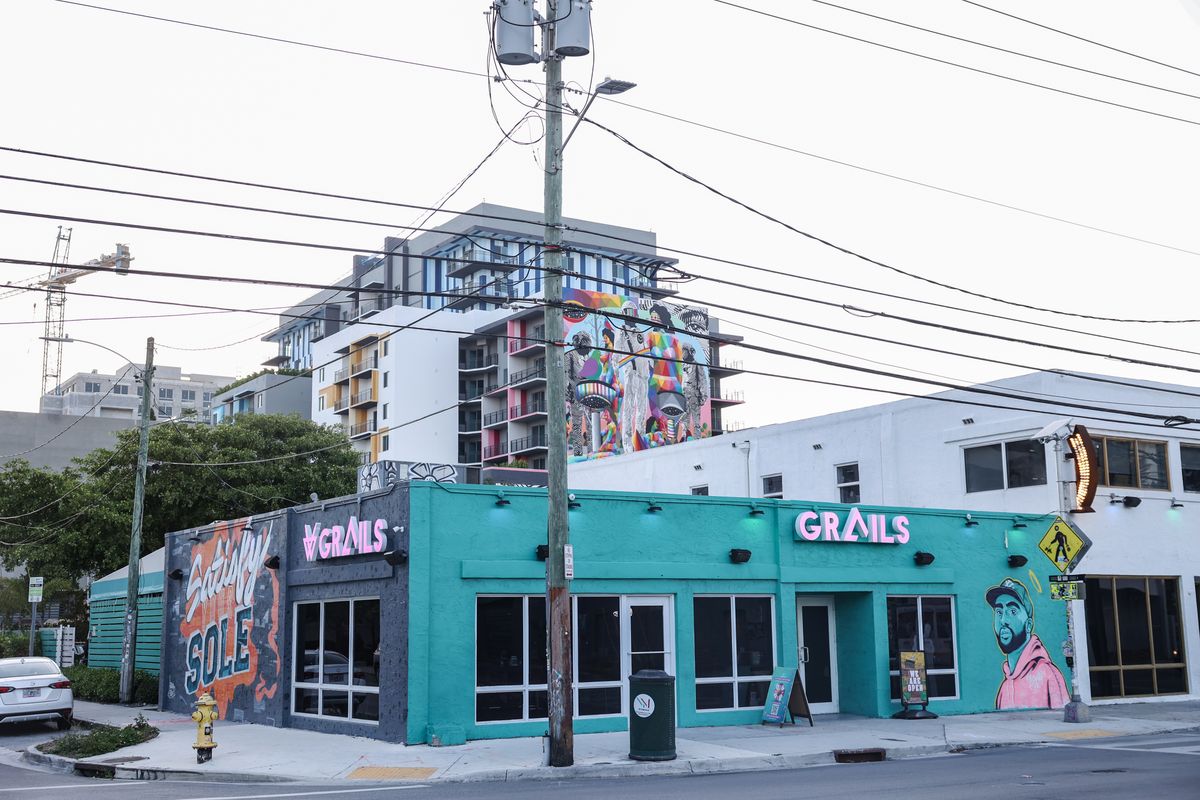 Grails Miami's teal corner storefront with pink neon signage on N Miami Ave, two blocks from Wynwood Walls.