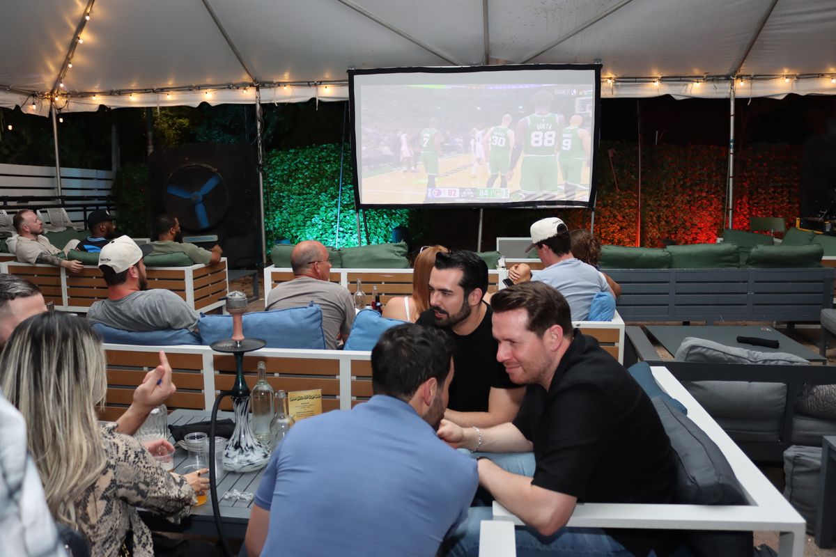 NBA Game 7 watch party under the Yard tent with hookah and projector at Grails Miami — sports + hookah in Miami