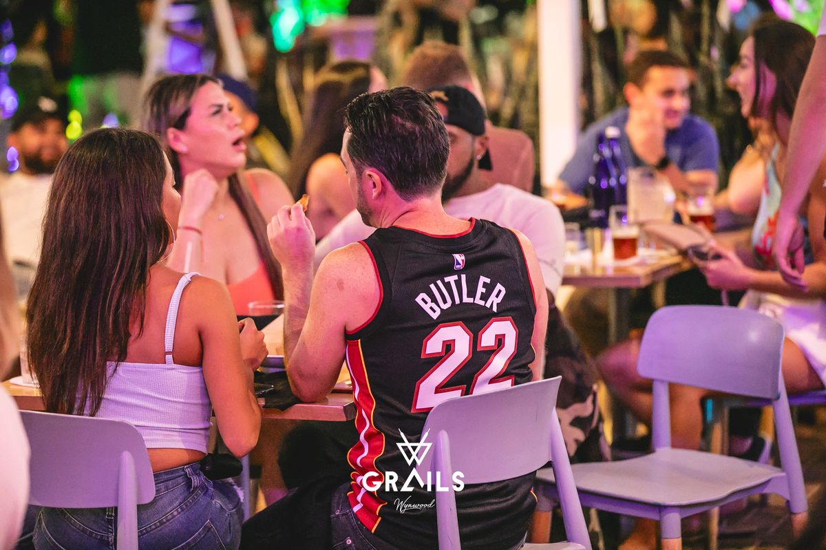 Miami Heat fan in a Jimmy Butler jersey at Grails Miami during an NBA game