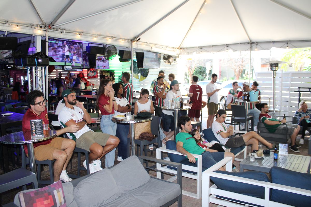 Group of Fluminense fans cheering during a Brasileirão watch party at Grails Miami