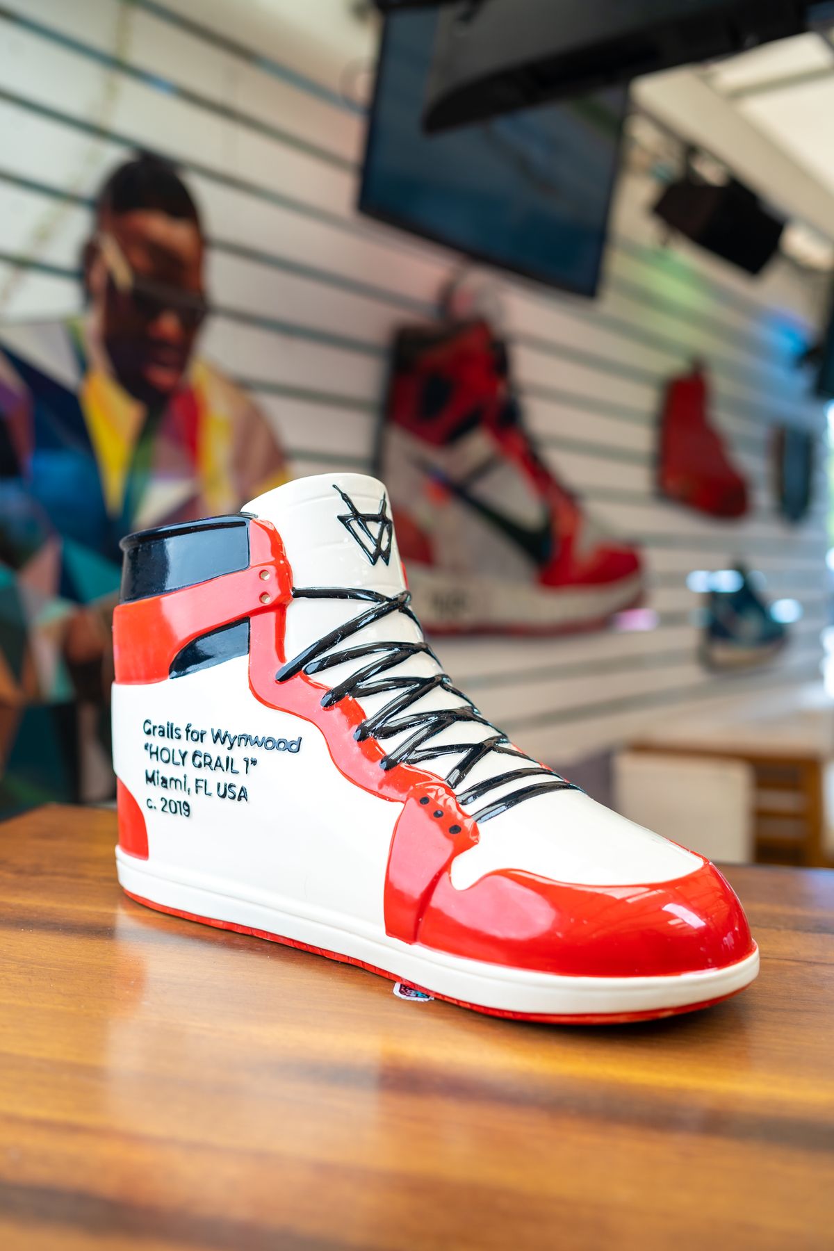 Detail of the hand-lettered Holy Grail Sneaker Cocktail Vessel inscription at Grails Miami Wynwood: 'Grails for Wynwood, Holy Grail 1, Miami, FL USA, c. 2019', a hand-painted ceramic Air Jordan 1 cocktail cup.