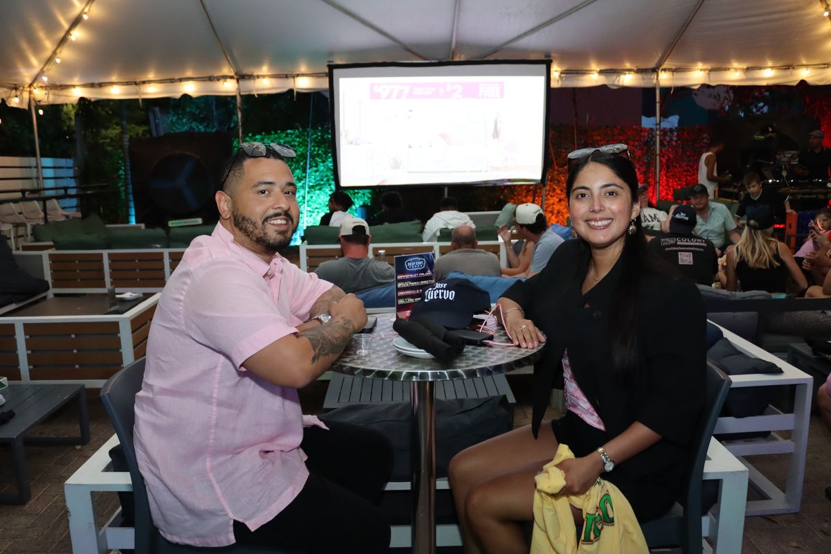 Couple at outdoor patio table at Grails Wynwood