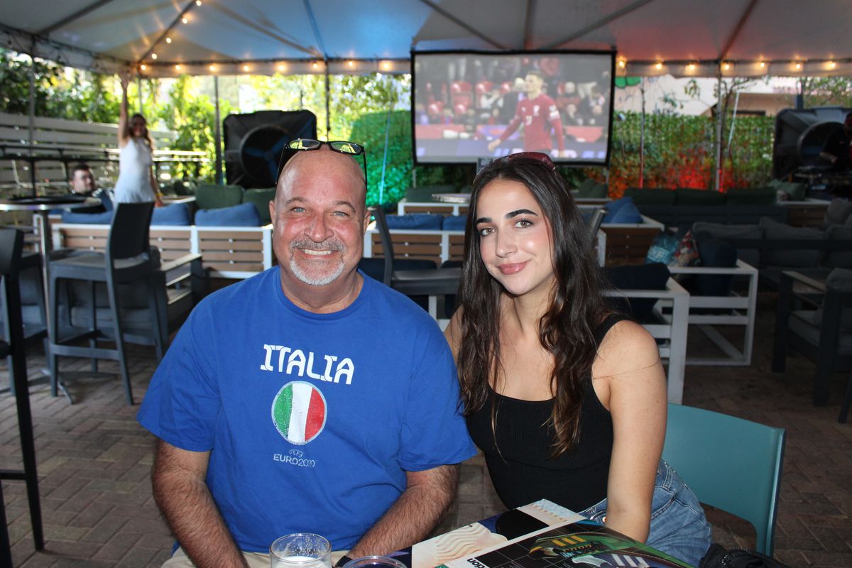 Italian football supporters in an Italia shirt posing on the Grails Wynwood patio during a Serie A watch party in Miami