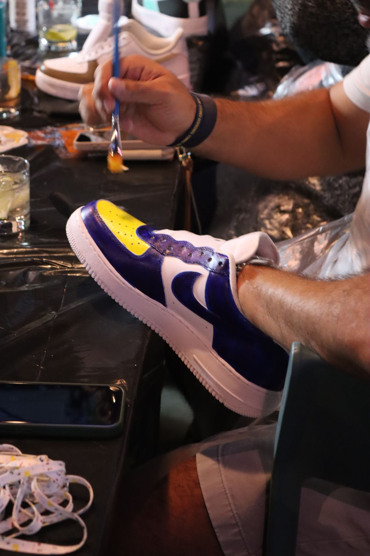 Grails Miami Kick Art Sneaker Workshop: UFC night on the covered patio with a packed crowd