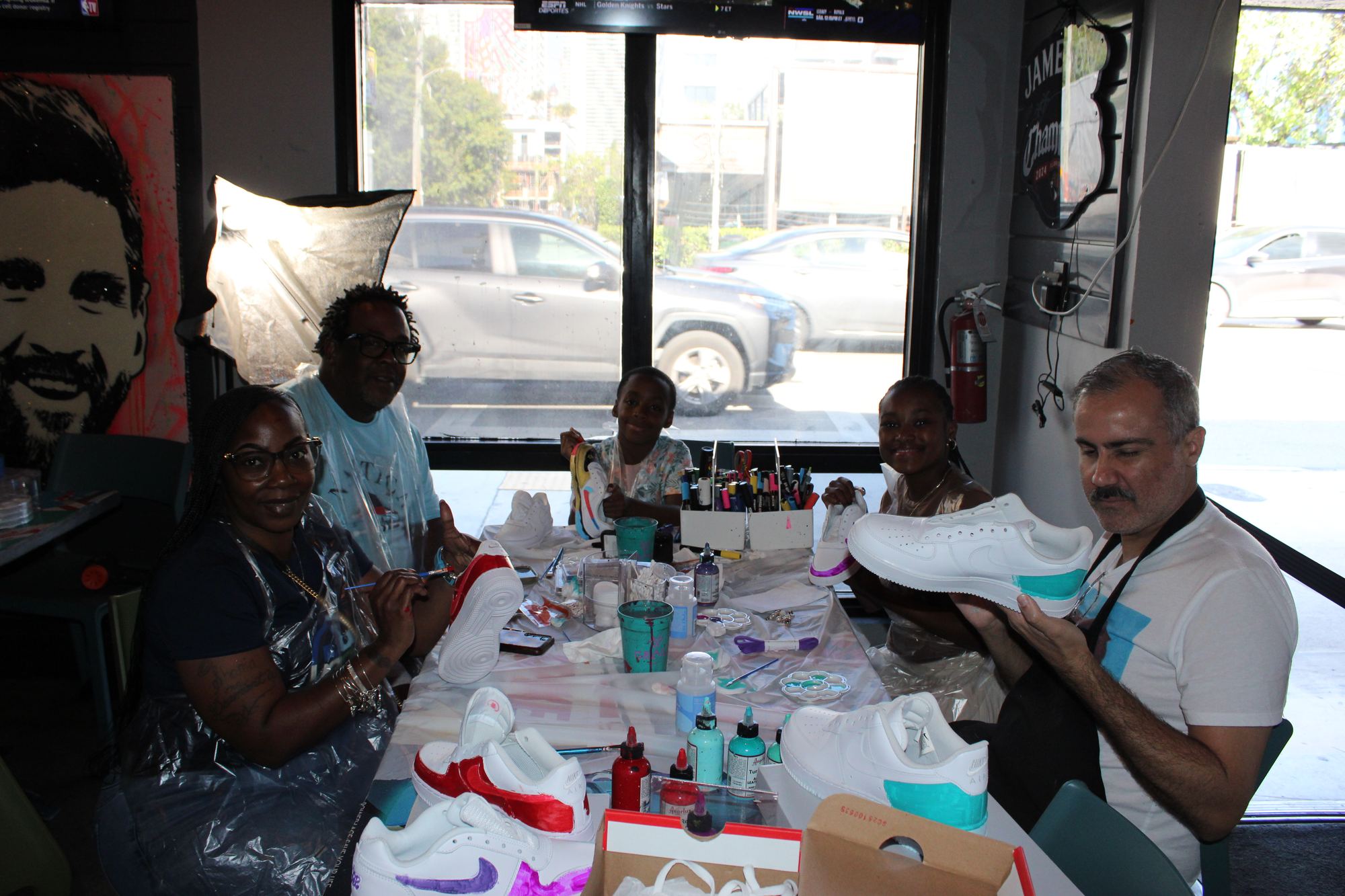 Sneaker design workshop participants customizing white Nike Air Force 1s at the Kick Art Workshop, hosted at Grails Miami in Wynwood.
